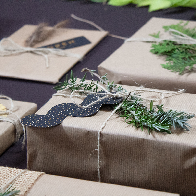 Eco-friendly gift wrapping ideas with gift tags and plants