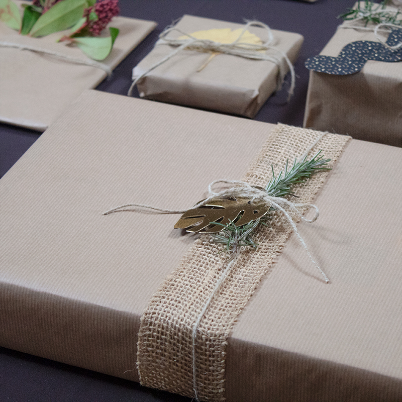 Eco-friendly gift wrapping ideas with craft paper and plants