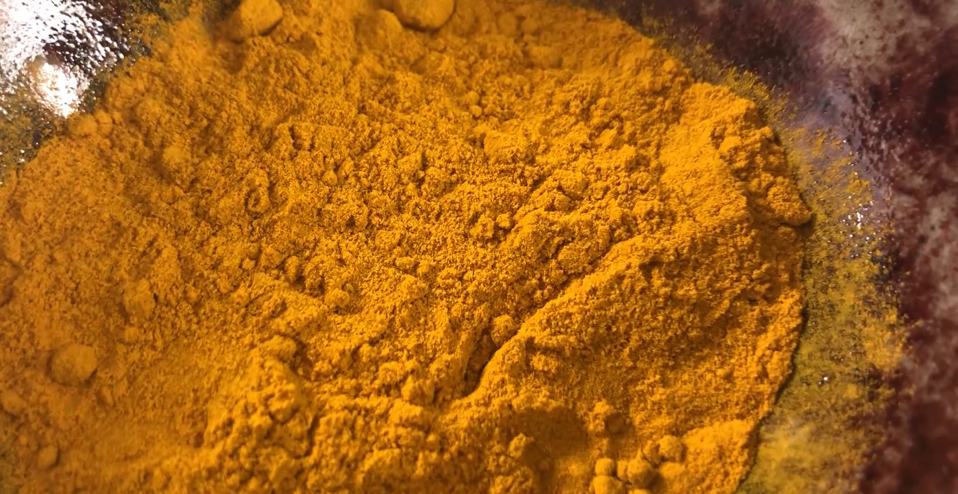 Straining the turmeric mix