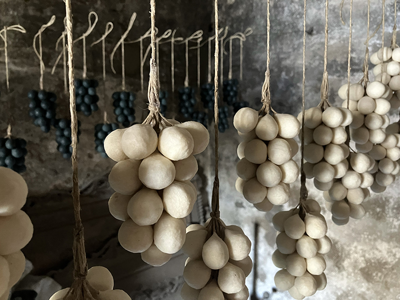 bunches of grape soaps drying in the sun in the Lebanese workshop