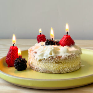 Fruit candles on cake by Botanopia