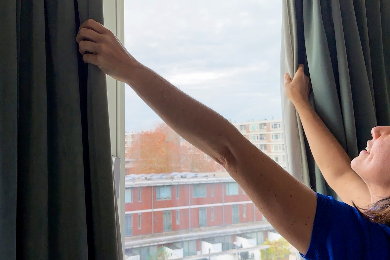 Closing the curtains to block UV light